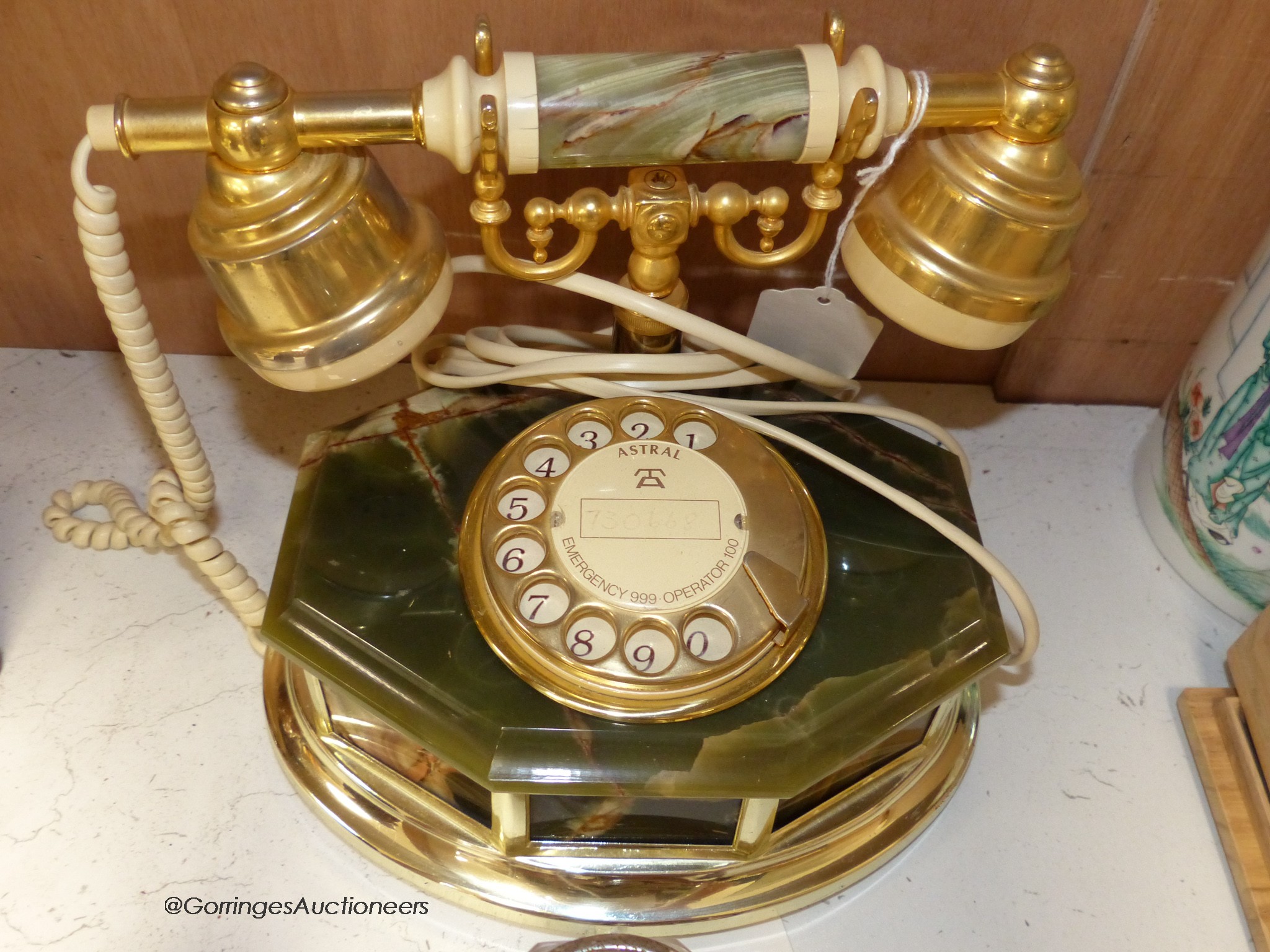 A pair of brass letter scales, a 1960's plastic table top lighter and an onyx telephone